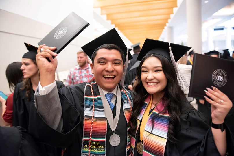 Graduates Josh Rios and his sister celebrate