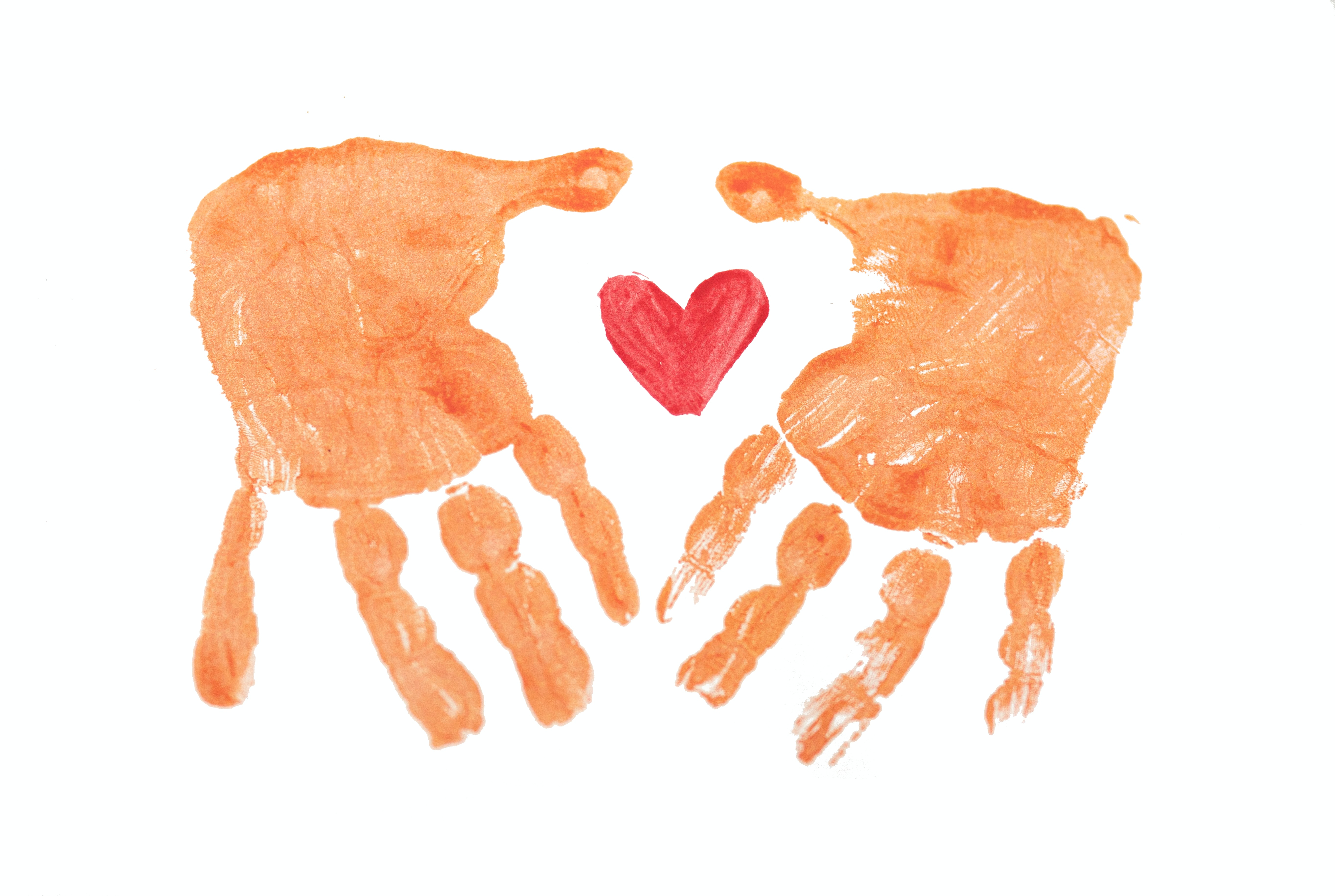Two orange handprints with a red heart inside